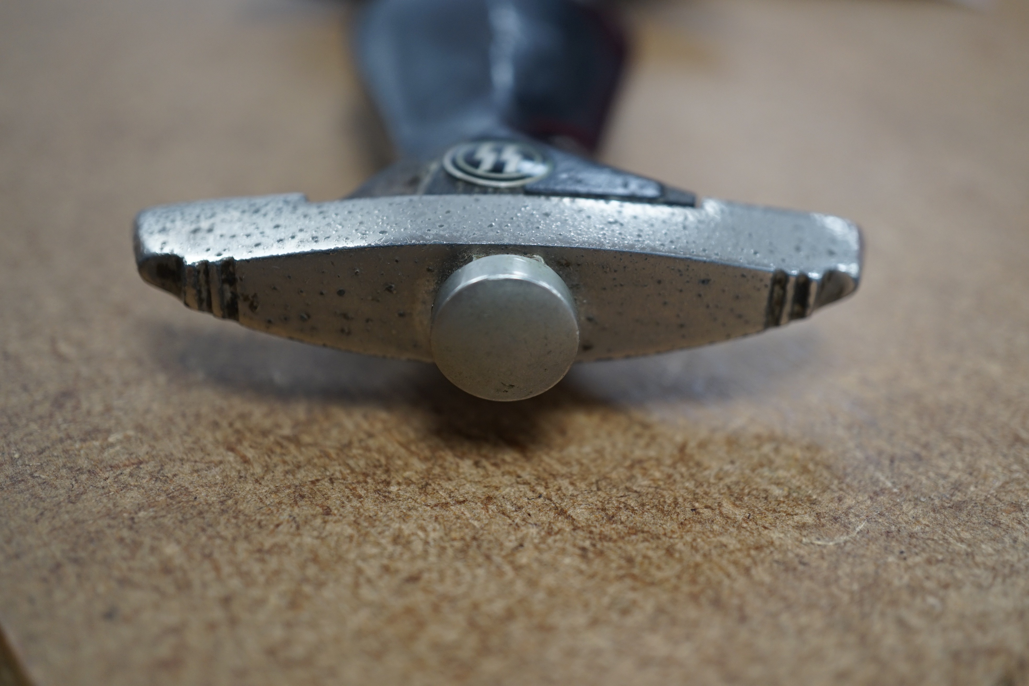 A Third Reich SS dagger, German steel helmet and a Nazi flag